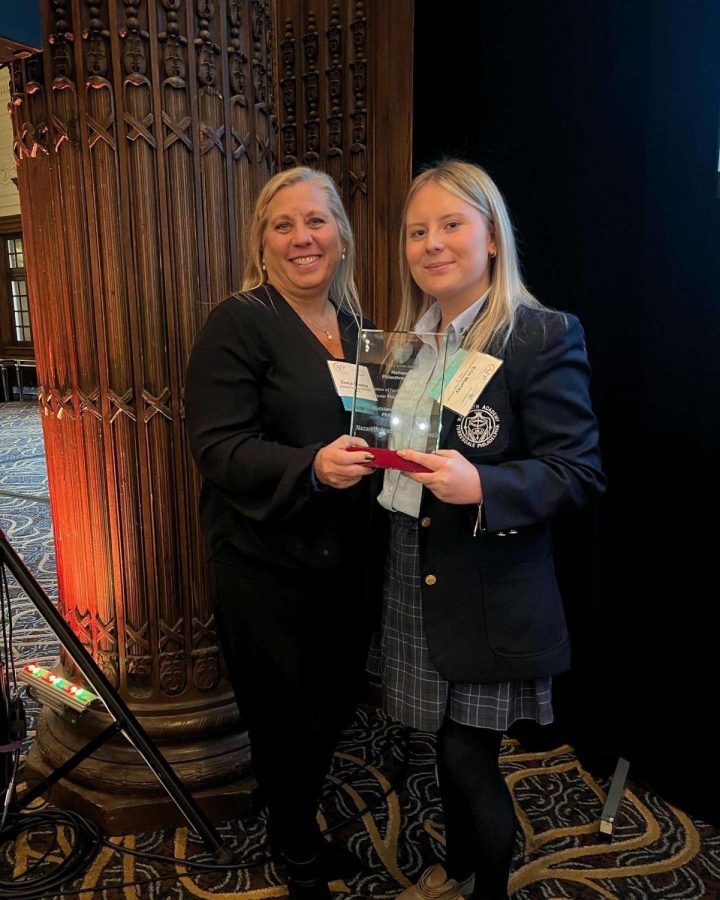 Pictured is the Senior Director of Operations, Erin Murray, and the Club Moderator, Mrs. Sylvester, with the award.